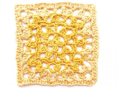 Flat lay image of a lacy crochet square