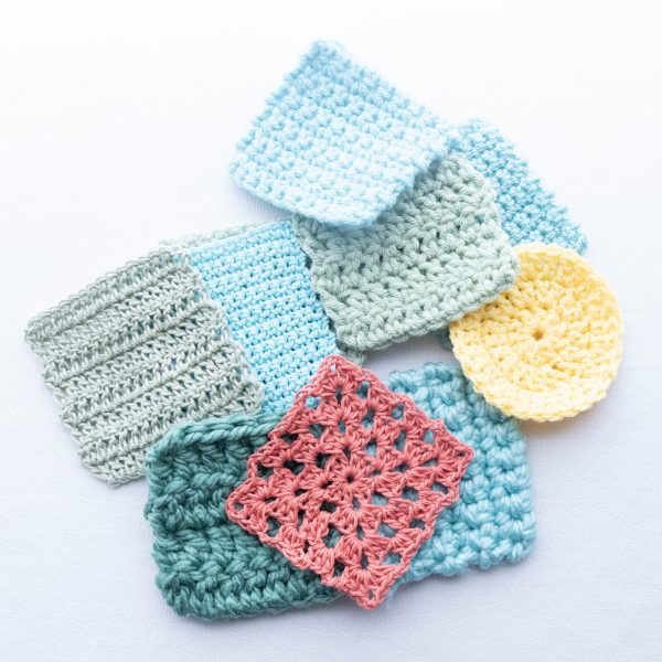 Several crochet gauge swatches arranged in a square frame