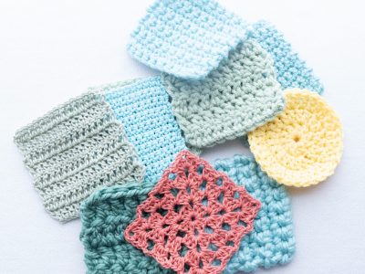 Several crochet gauge swatches arranged in a square frame