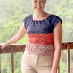 Modeling a crochet stripped top and smiling