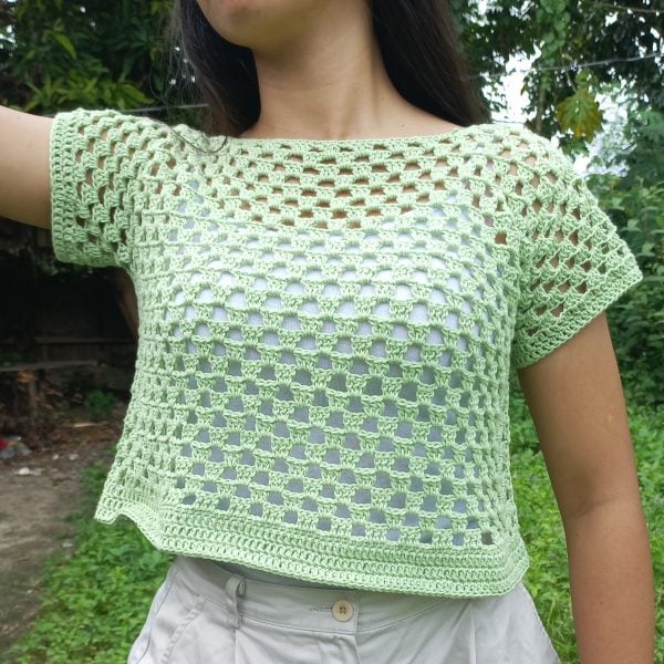 Granny stitch green crochet top being modeled