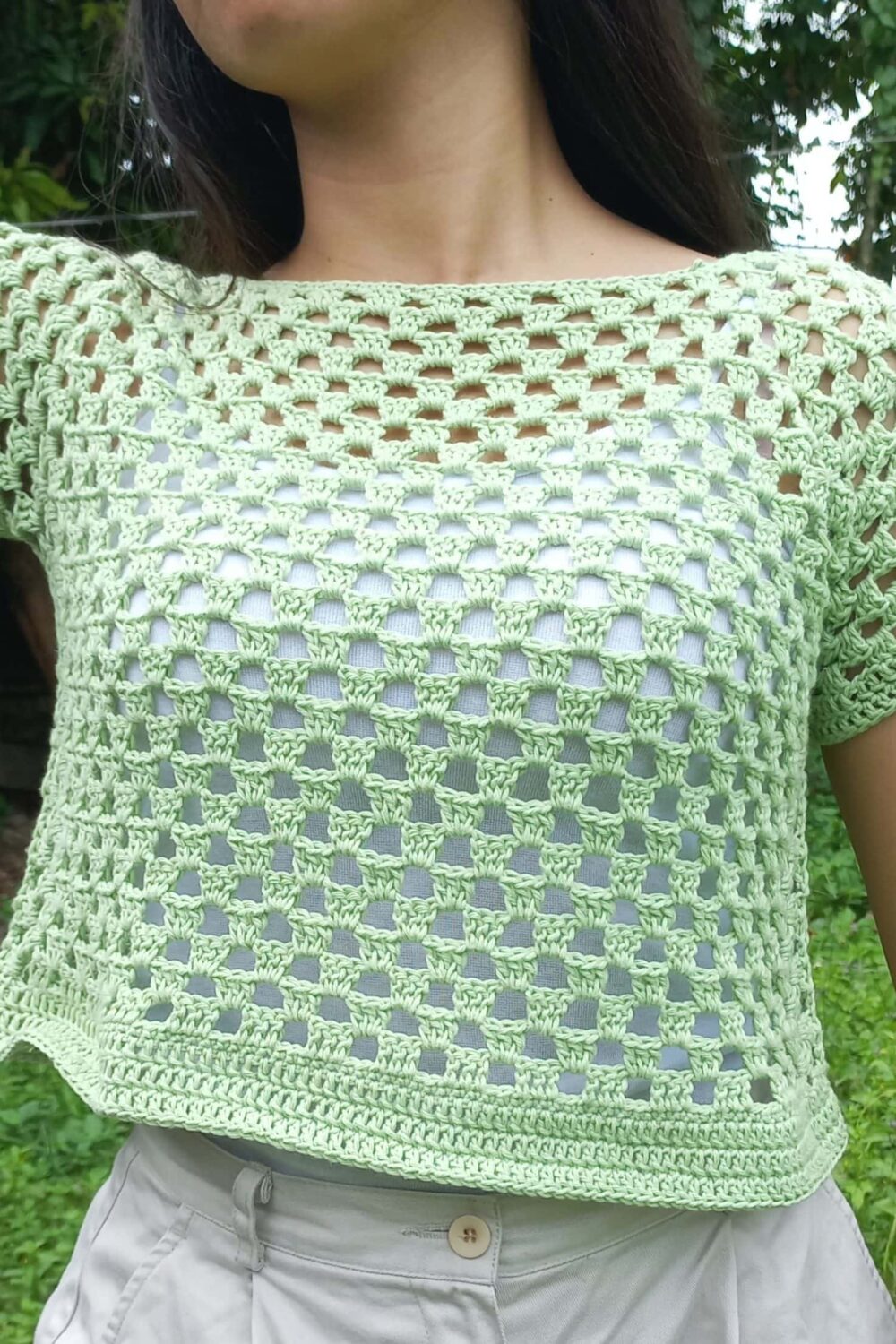 Granny stitch green crochet top being modeled